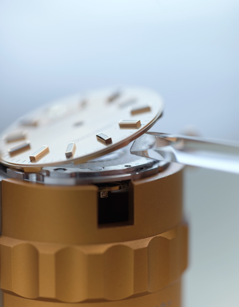 Watch case being opened for servicing
