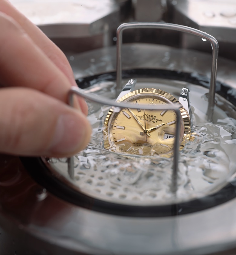 The waterproofness test being performed on a Rolex watch